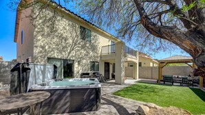 A house with a hot tub, patio furniture, and a covered outdoor seating area. - King Suite -Spa- Fast Wifi (Las Vegas)