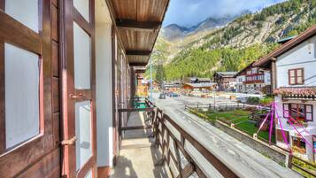 Enjoy breathtaking views of the village from this traditional balcony.
