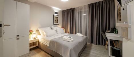 1 bedroom, desk, iron/ironing board, travel crib