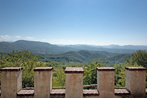 A view of a mountainous landscape with a clear sky.