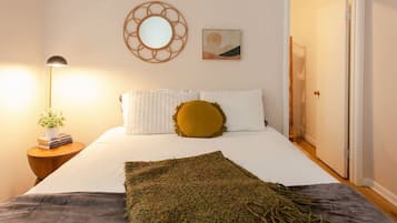 1 bedroom, desk, iron/ironing board, travel crib