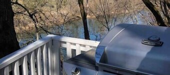 R&R on the Rogue River! This 2 BR cottage in Gold Hill features a private hot tub with stunning scenic views. Enjoy a spacious, private setting perfect for relaxation, adventure, or remote work