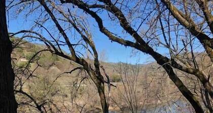 R&R on the Rogue River! This 2 BR cottage in Gold Hill features a private hot tub with stunning scenic views. Enjoy a spacious, private setting perfect for relaxation, adventure, or remote work