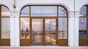 The entrance to Le Spa with a glass facade and arched doorways. - Radisson Blu Grand Hotel & Spa, Malo-Les-Bains (Dunkirk)