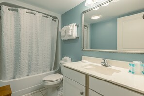 Combined shower/bathtub, hair dryer, towels, toilet paper