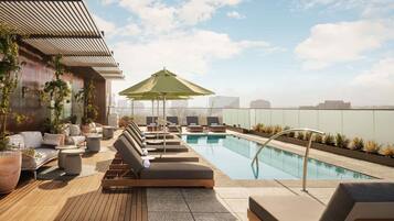 Outdoor pool, pool umbrellas, sun loungers