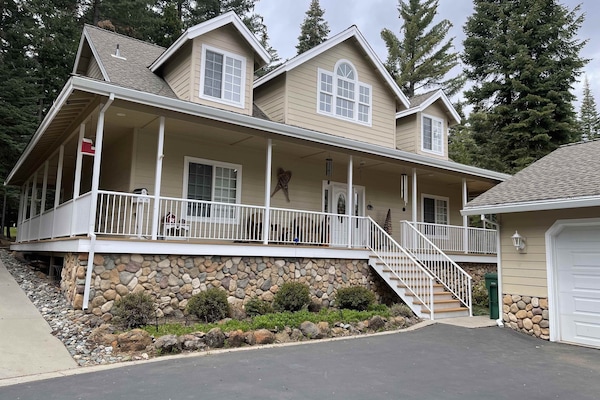 The beautiful cabin offers a relaxing wrap around porch and plenty of parking!