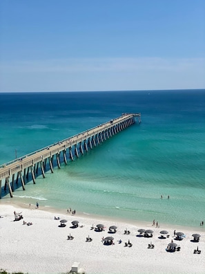 A pier extending into the ocean with a beach in the foreground. - 4-bedroom oasis  in Navarre with enclosed heated  pool (Navarre)