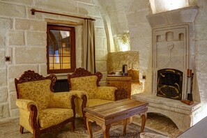 Superior Triple Room | Living area | 40-inch LED TV with satellite channels, TV