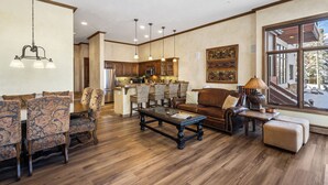 A spacious living area with a dining set, a sofa, and a coffee table. - Excellent location in Mountain Village core, spacious and cozy condo (Mountain Village)