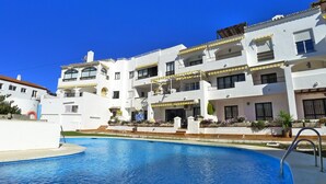 A multi-story hotel with a swimming pool in front. - Ap140 Alcazaba 2D (Nerja)