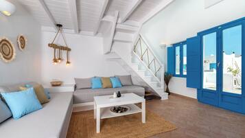 Superior Suite with Pool View | Living area | Flat-screen TV