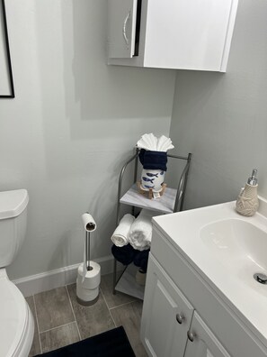 Combined shower/bathtub, hair dryer, towels, soap