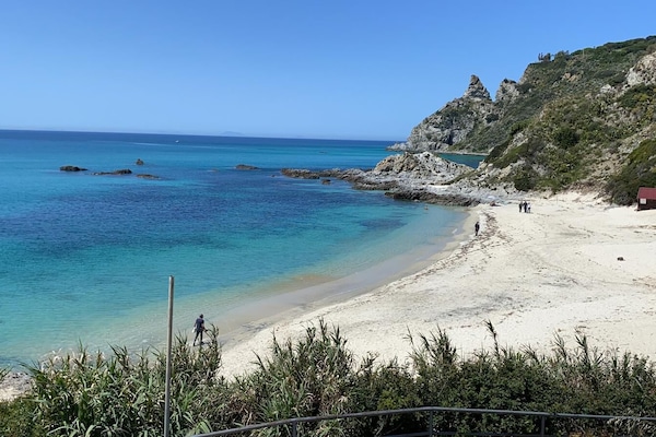 On the beach, sun-loungers