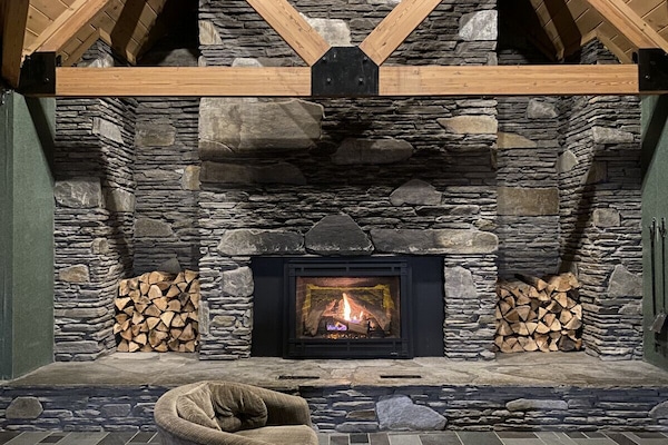 Relax by the fire in the Lodge`s Great Room