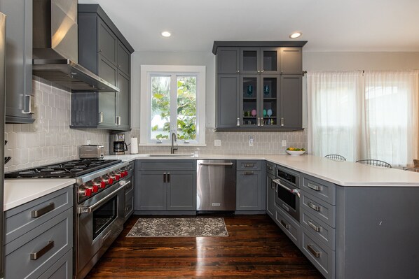 Enjoy cooking in this well-equipped kitchen with oven, stovetop, and dishwasher.