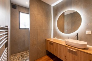 Shower, hair dryer, soap, toilet paper