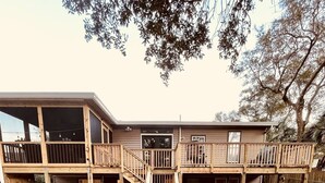 A two-story building with a covered patio area labeled 'Unit C' and 'Unit B'. - Unit C, Spirit of Folly, Pet Friendly,  2 short blocks - 100 yards to the beach (Folly Beach)