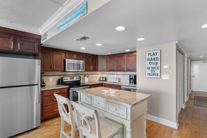 Fridge, microwave, oven, stovetop - Garden City Beach Oceanfront Condo 1202 | Rising Tides Properties Rental (Murrells Inlet)