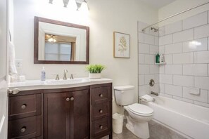 Bathtub, hair dryer, towels, soap