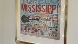 A framed poster with text and graphics, including the words "Tupelo," "Mississippi," and "Lee County." - Easy walk to restaurants, coffee and ice cream shops, retail shopping, and more! (Tupelo)