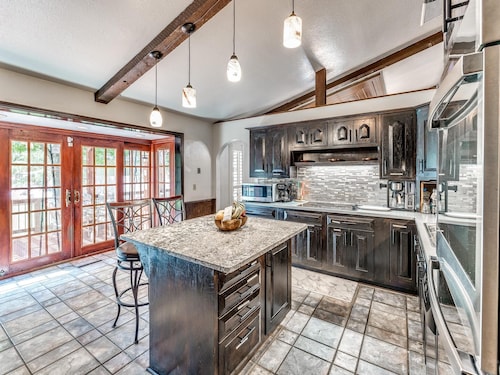 Beautiful home with large outdoor pool and hot tub. Large beautiful backyard