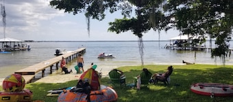 Lakefront getaway with white sand, clear water, gorgeous sunsets