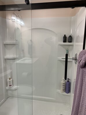 Shower, hair dryer, towels, soap