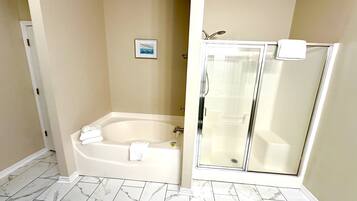 Combined shower/tub, hair dryer, towels, soap