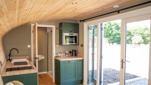 A compact kitchen with a microwave, sink, and cabinets. - Hare’s Retreat - ( Middle Cabin )  - sleeps 2 guests  in 1 bedroom (Foolow)
