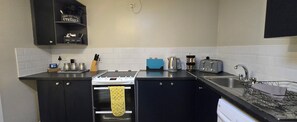 Fridge, microwave, toaster, cookware/dishes/utensils