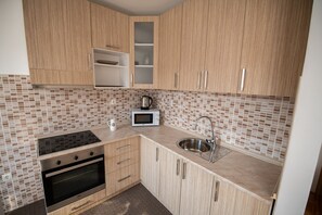 Dishwasher, toaster, blender, dining tables