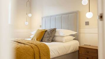 1 bedroom, desk, iron/ironing board, travel crib