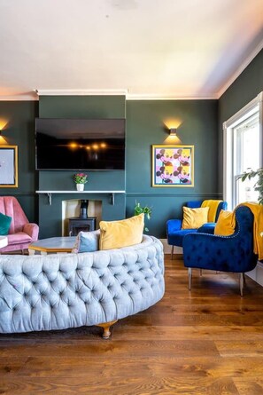 Appartement, Meerdere bedden | Woonkamer | Een open haard