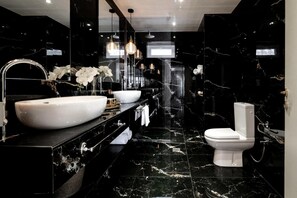 A modern bathroom with a large white sink, a toilet, and a mirror. - Maison Downtown Luxury Apartments - Maison Downtown Luxury Apartment (Zakynthos)