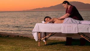 A massage therapy session by a lakeside during sunset. - Villa Bala - Seaside Luxury Villa - Villa Bala - Seaside Luxury Villa (Zakynthos)