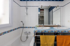 Bathtub, hair dryer, towels