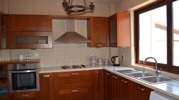 Luxury Villa | Private kitchen | Full-sized fridge, stovetop, high chair, spices