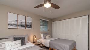 A bedroom with two beds, a ceiling fan, a window with blinds, and a wardrobe. - ⭐️POOL|GAMEROOM*Lanai Hangout*Open Concept Design🌊 (Ocala)