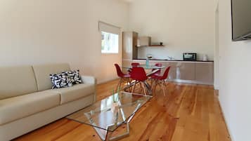 Superior Apartment | Living area | 32-inch LED TV with cable channels, TV