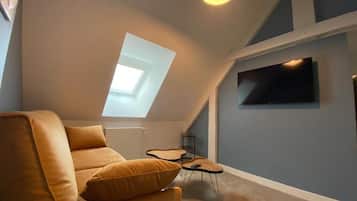 Family Suite | Living area | Flat-screen TV