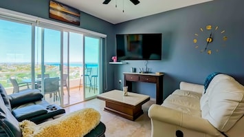 Comfortable living space with cozy sofas and a TV with streaming services