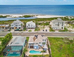 Enjoy ocean views from these modern two-story homes with large windows and a swimming pool.