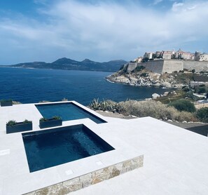 Outdoor pool, a heated pool - Waterfront apartment, prestige villa, sea access (Calvi)