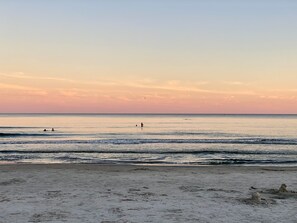 Enjoy a serene beach experience with calm waters and expansive sand.