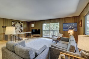 Relax in style with a plush sectional sofa, flat-screen TV, and dining area, all surrounded by beautiful views.