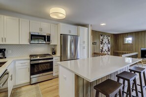 Enjoy casual dining at the kitchen island with bar stools.