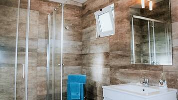 Shower, towels, soap, toilet paper