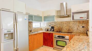 Fridge, microwave, stovetop, coffee/tea maker