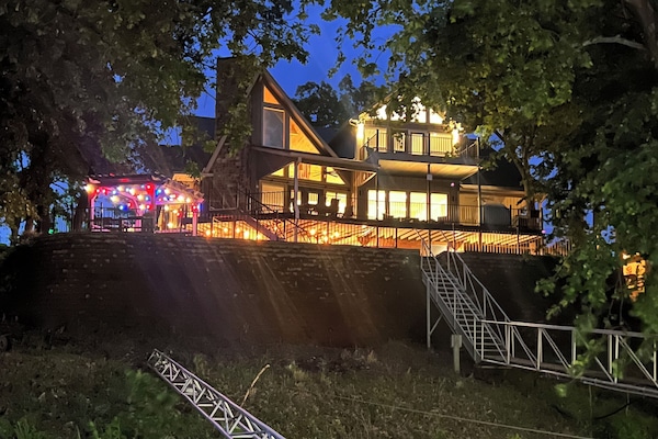 View of house at night from dock